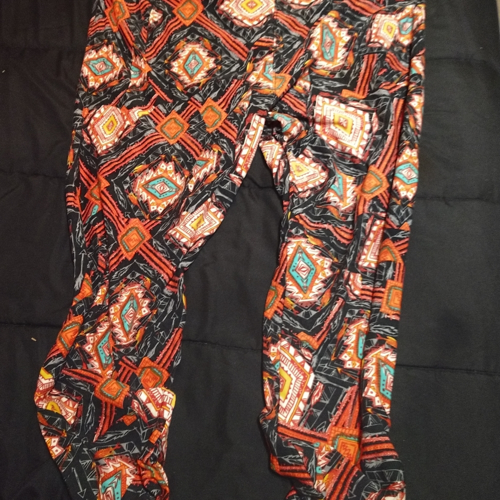LuLaRoe TC2 orange leggings with turquoise geometric patterns